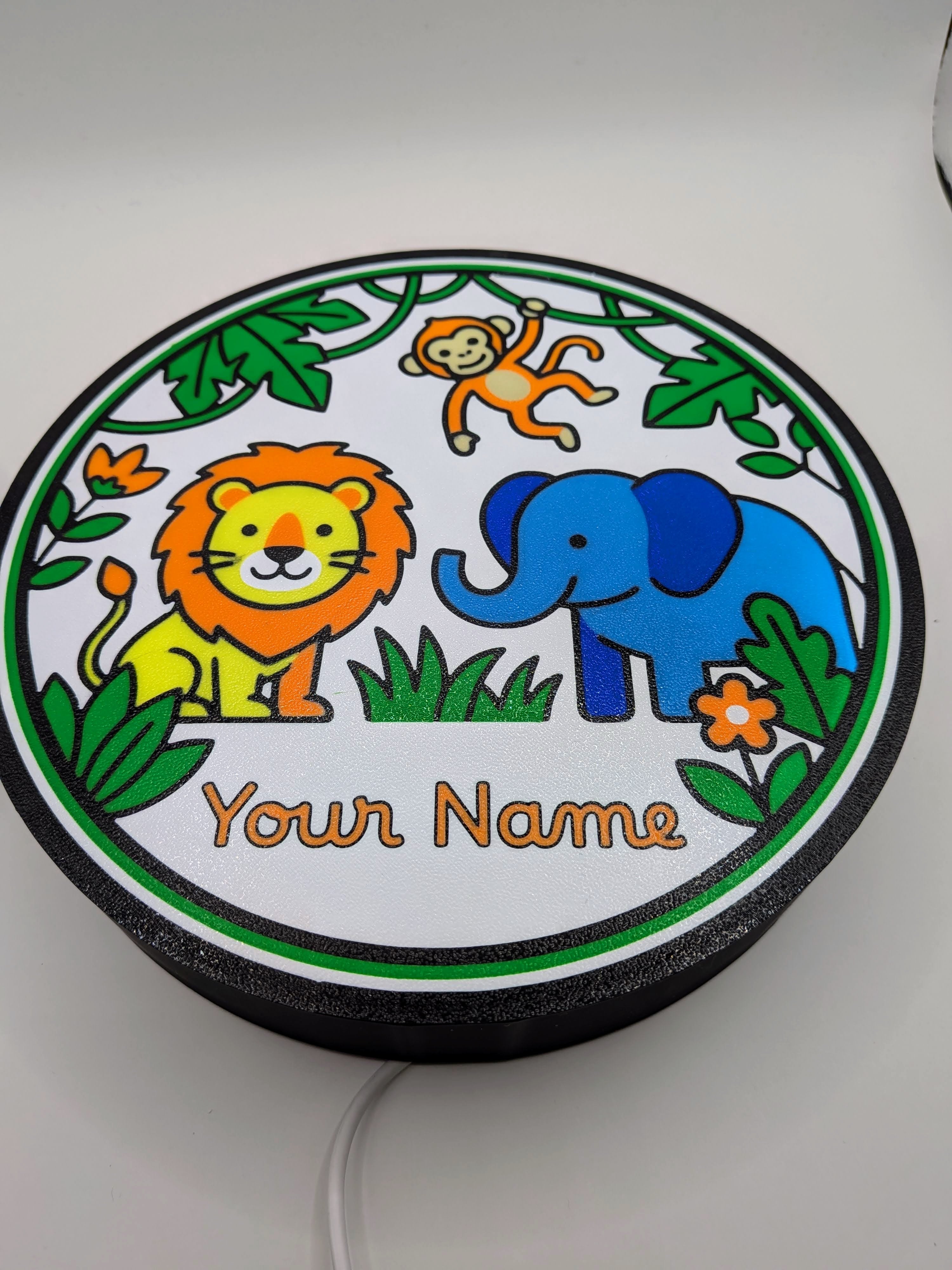 Lampada LED rotonda con leone, elefante e scimmia, bordo verde