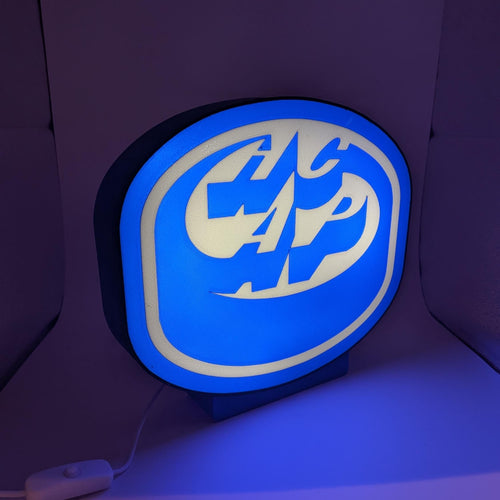 Round LED hockey lightbox lamp with blue HCAP logo, black border, small stand base