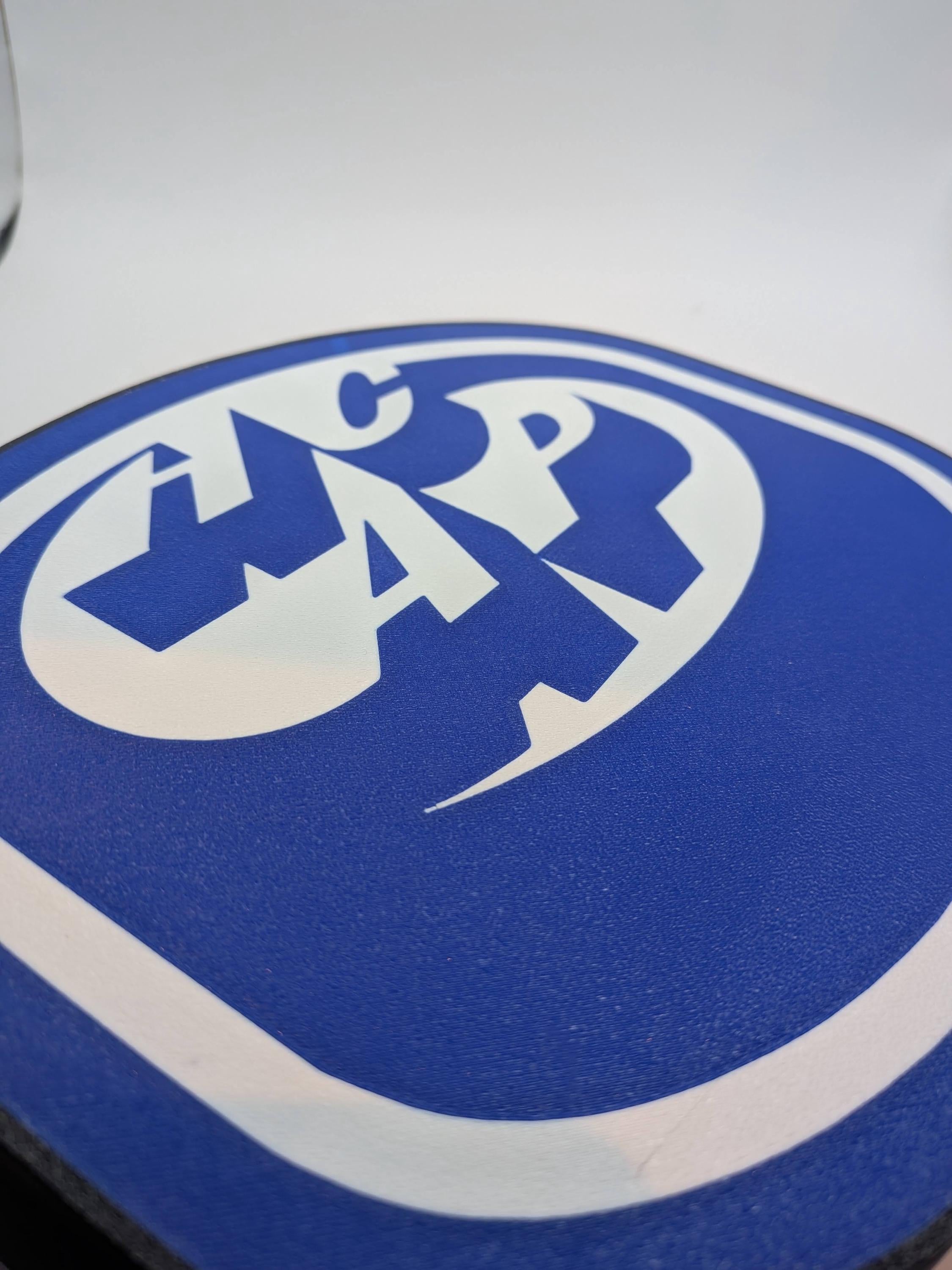 Close-up of blue HCAP hockey logo on LED lightbox lamp with white outer ring