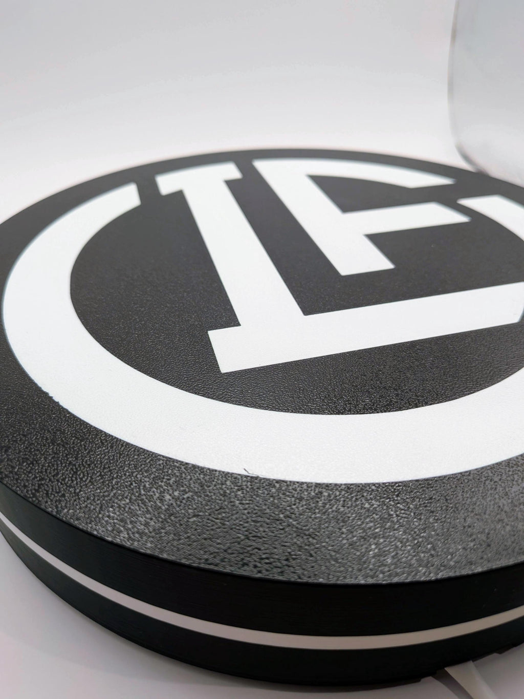 Lightbox LED rotonda con logo FC Lugano bianco, effetto luminoso a bordo