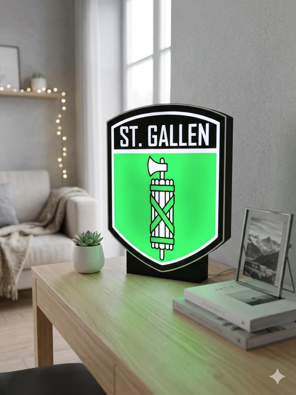 Lampada LED lightbox con stemma ST. Gallen su supporto nero, luce verde