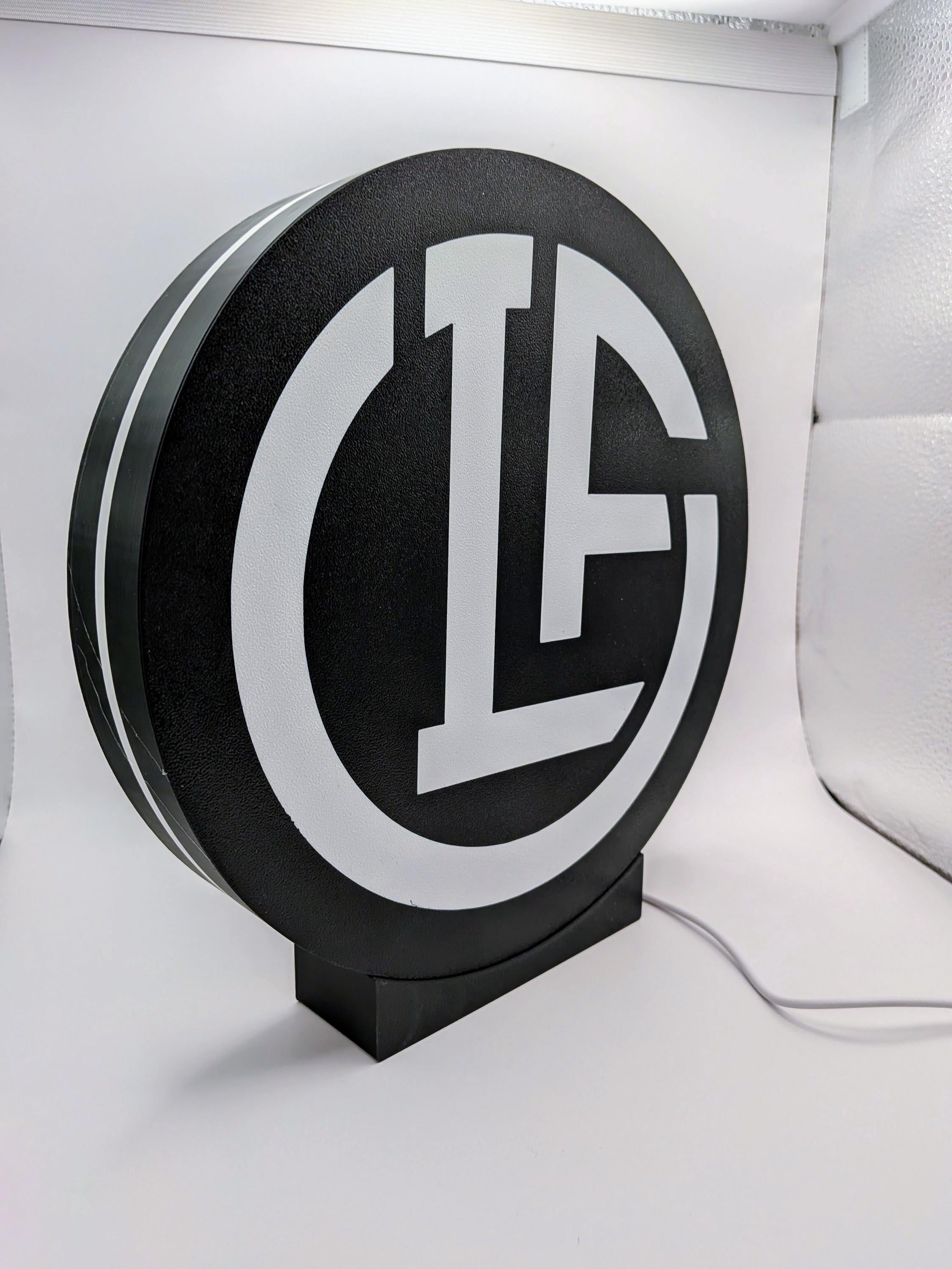 Lampada LED lightbox circolare con logo FC Lugano su sfondo bianco, base nera