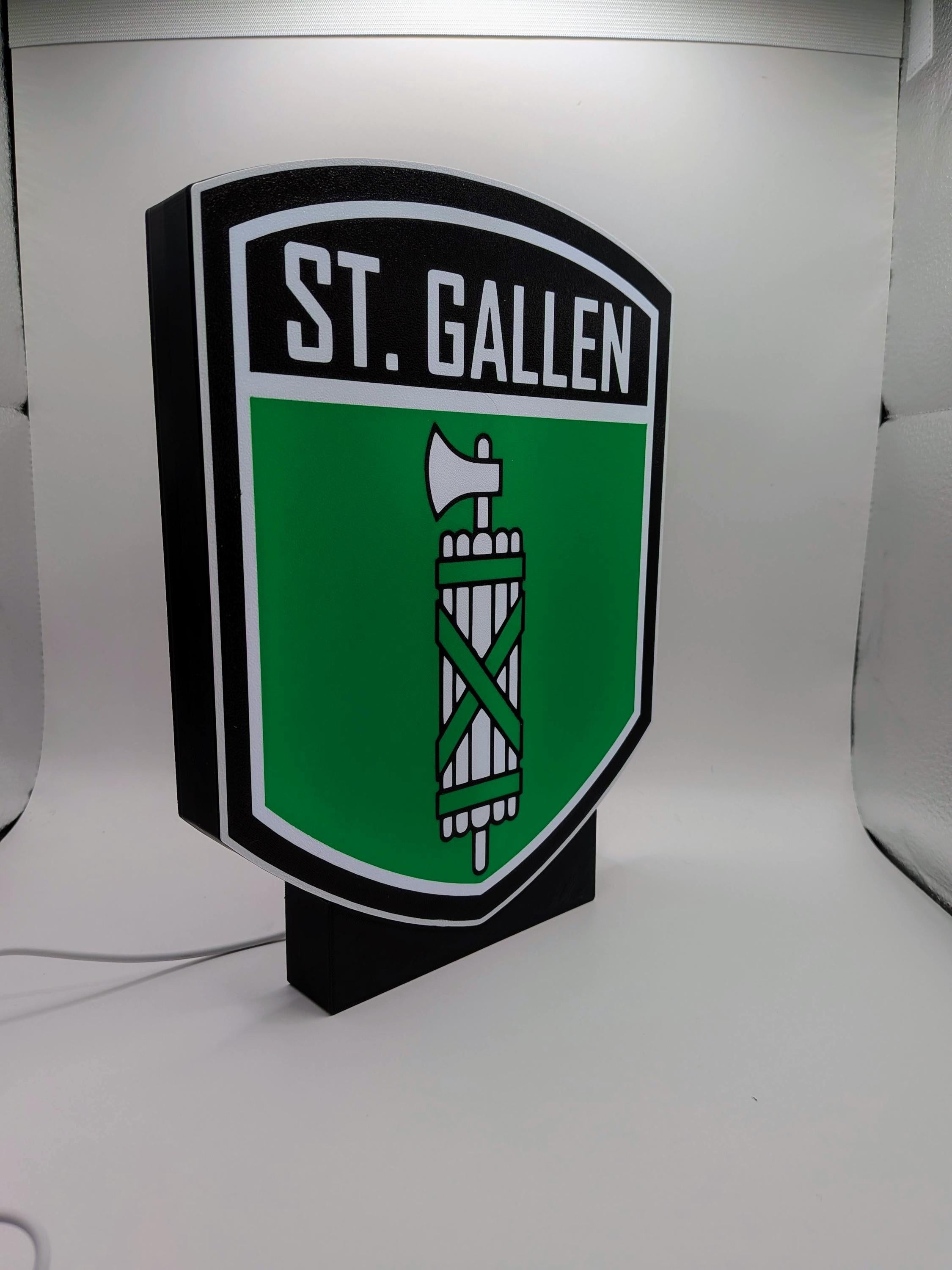 St. Gallen crest LED shield lightbox lamp, green lit graphic on black frame