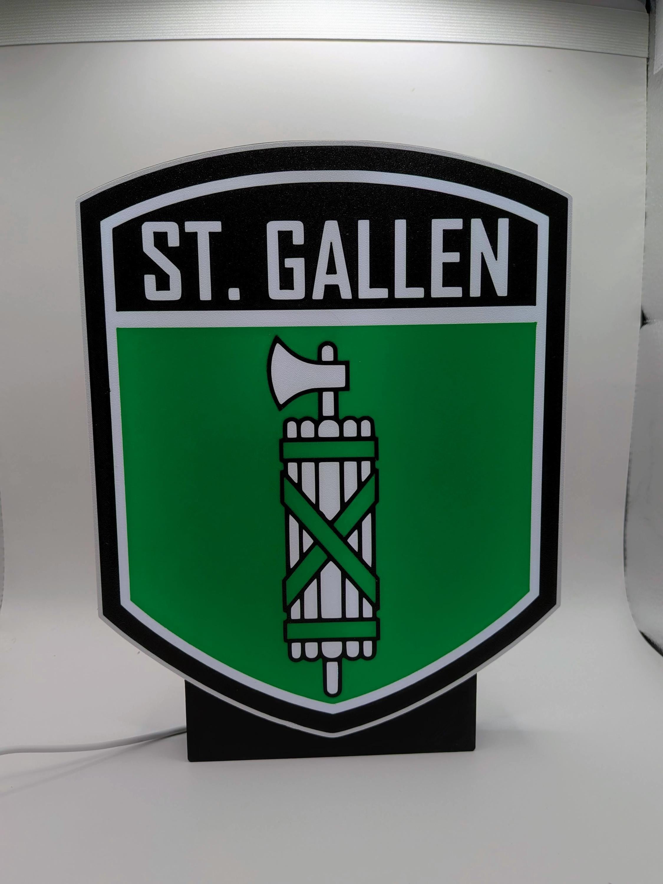 Lampada LED lightbox St. Gallen con stemma su sfondo verde, corpo nero