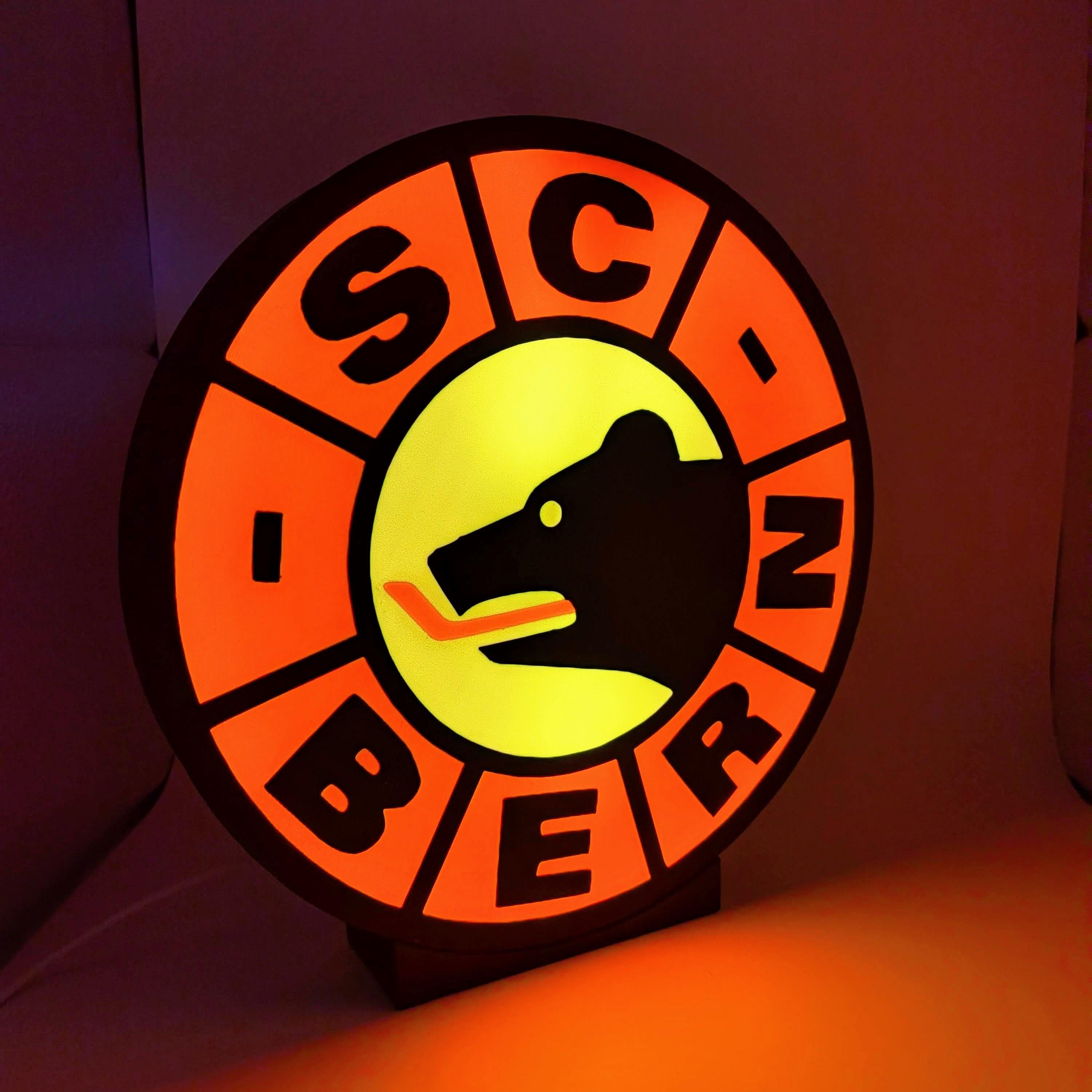 Lampada LED hockey con lightbox circolare SC Bern, corona arancione e logo giallo